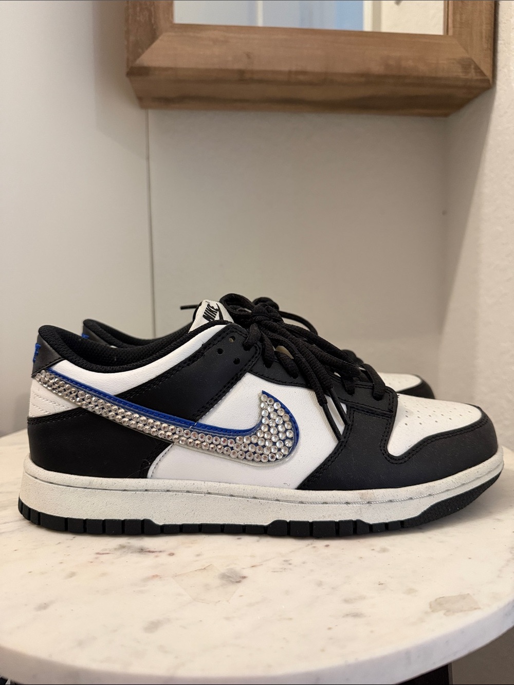 Youth 7Y Nike Black and White Low-Top Sneakers with Blue Accent